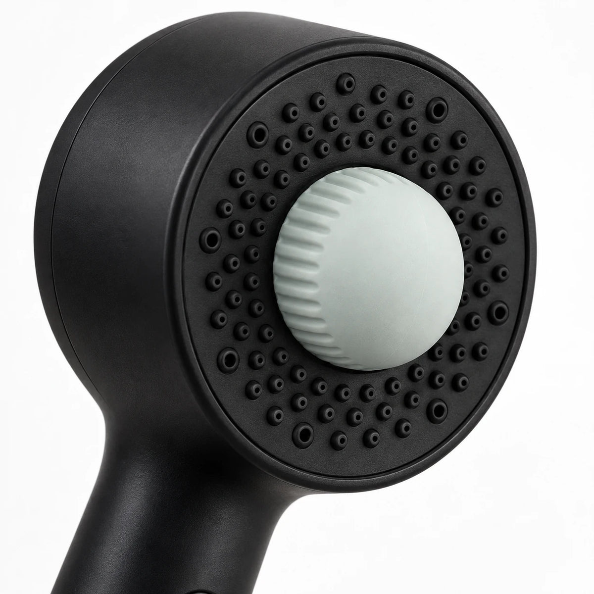 Close-up of the rounded Dusty Leaf Dome inside the black handshower