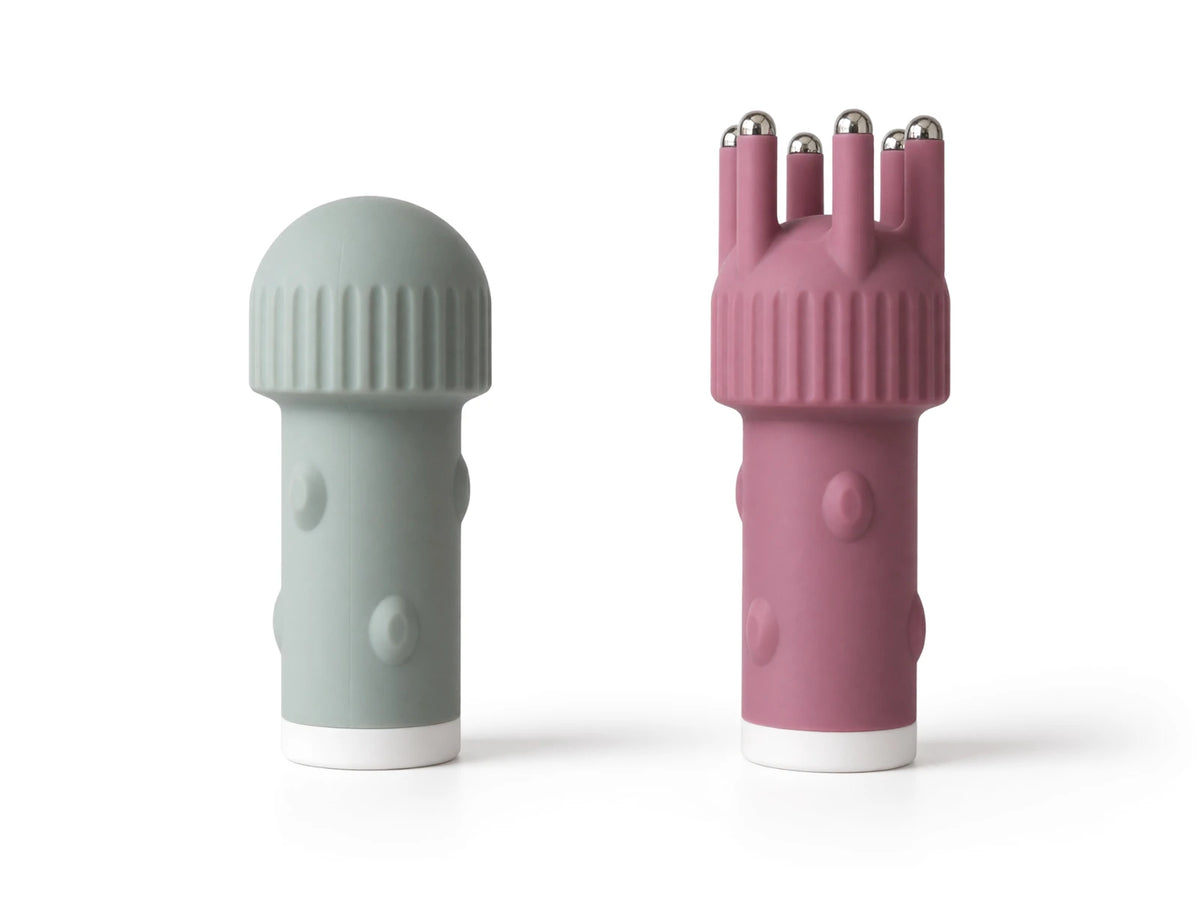 The two separate included massage modules: Dusty Leaf tone Dome and Magenta tone Claw with six metal-tipped fingers
