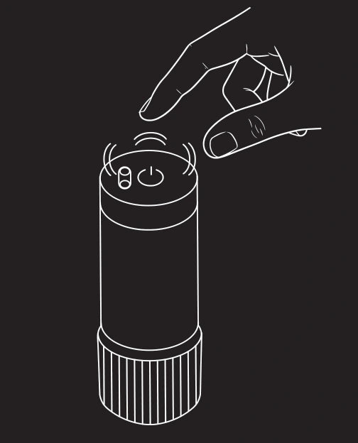 Original product-guide illustration showing a finger pressing the power button on the end of the massage module